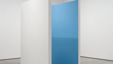 Minimalist art installation in a white gallery space. Clean lines, sky blue accent, North American / International sophisticated atmosphere.