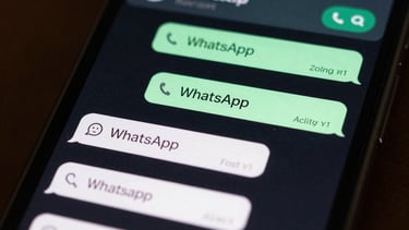 A tight macro shot of a custom WhatsApp chat flow interface showing automated responses and AI chatbot logic, dark mode interface glow