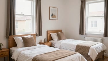 A bright, tidy bedroom with a single bed and soft natural light.