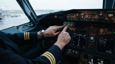 Close-up of a pilot's hands executing a pre-flight checklist on a Boeing flight deck, cool morning cockpit lighting, sharp focus on technical instruments, 35mm