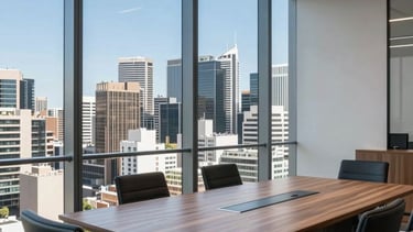 A professional and sophisticated office meeting space in a Sydney high-rise. Large windows reveal a glimpse of the Australian cityscape under a clear blue sky. The interior is modern with steel blue and muted grey tones, clean lines, and natural wood surfaces. High-end architectural photography style, bright and confidence-inspiring.