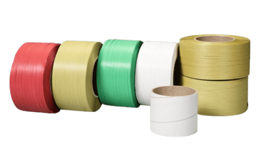 Various colorful polypropylene strapping bands and plastic packing tape rolls for industrial packaging.