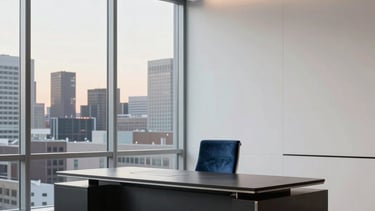 A minimalist, high-end North American office space in Minneapolis with clean lines and architectural depth. The scene features a polished deep charcoal desk, a subtle steel blue velvet chair, and large windows revealing a soft, twilight city view. The lighting is controlled and sophisticated, emphasizing a luxury consulting atmosphere.