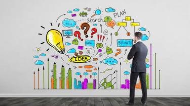 A man is observing an colourful idea process on a wall