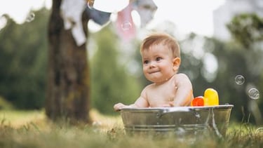 a baby in a tub tub with bubbles