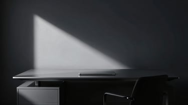 Minimalist dark executive workspace with sharp directional light cutting through deep shadows, cool silver tones, sharp focus, 35mm