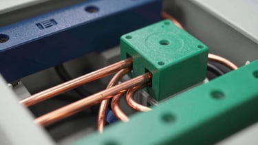 Macro close-up shot of precise copper busbars and intricate wiring within an industrial power distribution panel, sharp focus, crisp light.