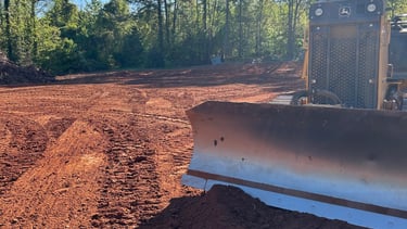 Dozer grading building pad