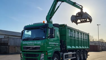 Darlington Recycle wagon with a hydraulic grabber for heavy lifting.
