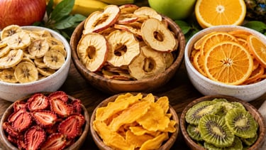 Healthy dehydrated fruit snacks made from apples, bananas, oranges, and mixed fruits.