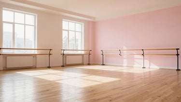 Wide panoramic view of a bright, sun-drenched dance studio interior, large windows letting in natural light, pristine wooden floor, ballet barres along one wall, soft powder pink and warm sand-beige accents, luminous editorial photography.