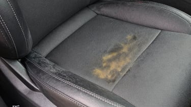 Before and after comparison of a car upholstery cleaned to perfection