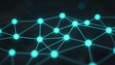 Macro view of glowing cyan and teal network nodes on a dark background, representing active data streams