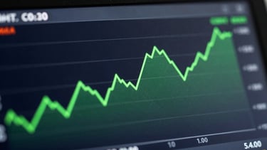A close-up of a high-contrast digital dashboard displaying financial cost-reduction charts, glowing emerald green trend lines on a deep slate background