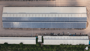 a large solar paneled building with solar panels