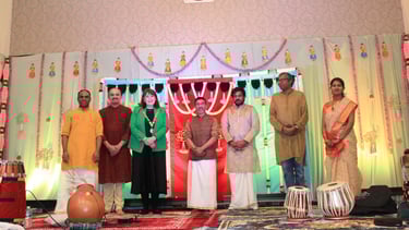 A picture of Rugby mayor felicitating the artists