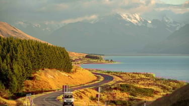 Campervan on road near coast