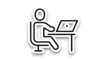 Digital nomad working on a laptop, representing remote work in rural settings.
