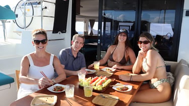 Guests enjoying gourmet lunch prepared by private chef onboard catamaran in Guanacaste