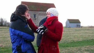 the author doing makeup on a film set