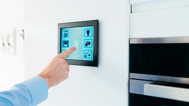 a person pointing at a wall mounted on a wall