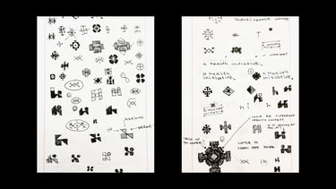 Minimalist logo design hand-drawn sketches on paper.