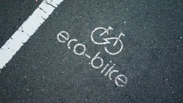 Eco-bike store spray paint on road logo mockup.