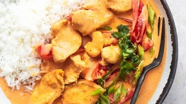 thm recipe chicken coconut curry in a bowl on marble