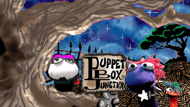 Puppet Cauldron: Gothlina, Strazi, and Oro at the Puppet Box Junction sign under the Thinking Spot T