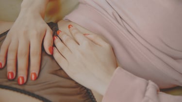 a woman placed her healing hands on her womb, lower abdomen