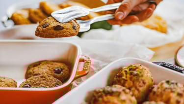 Taking cookies from the oven plate on the table
