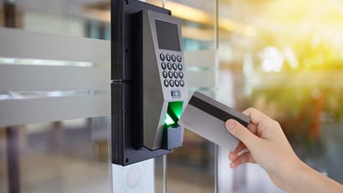 a person is holding a credit card and a credit card