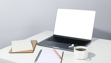 Tidy workspace with laptop and planner — lifestyle support provided by simplelilac organizers