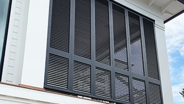 a porch enclosure made from shutters