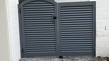 a side gate made from shutters