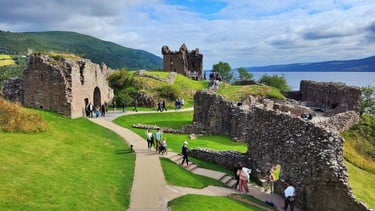 Loch Ness lies beyond Urquhart Castle in Scotland