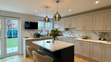a kitchen with a large island and a bar stool