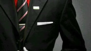 a man in a suit and tie with a red tie