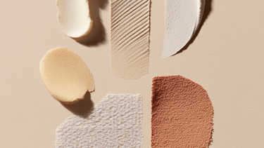 Textured skincare and makeup swatches showing various cream, lotion, and foundation product samples.