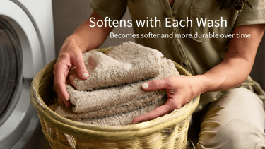 a woman holding a basket with towels and towels