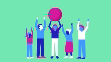 a group of people holding up a red ball