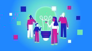 a group of people standing around a light bulb