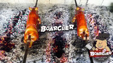 2 lechons being roasted