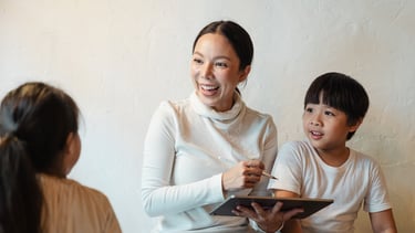 mother working with children on project