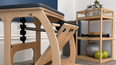 Pilates equipment including a chair and small equipment including weighted balls & magic circle