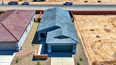 a house with a blue roof and a brown roof