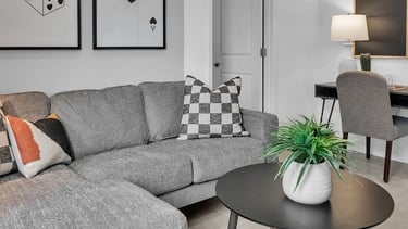 a living room with a couch and a table