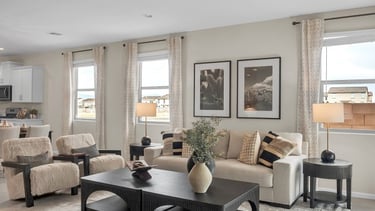 a living room with a couch and chairs