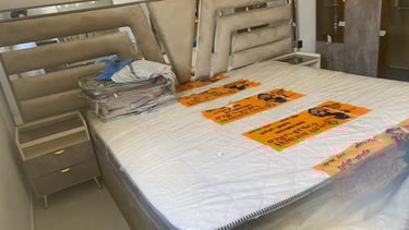 a bed with a mattress and a bed in a room