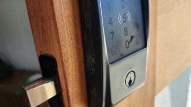 Keypad smart lock installed on a wooden exterior door